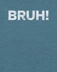 Close-up of teal Milk Sandwich T-shirt with bold, cracked white text that says BRUH! minimalist and expressive streetwear graphic design.