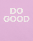 Close-up of pink Milk Sandwich T-shirt with bold distressed white text that reads DO GOOD minimalist motivational graphic tee.