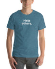 Front view of man wearing blue Milk Sandwich T-shirt with faded white text that reads Help others clean, minimalist message tee for everyday wear.