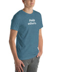 Angled view of man wearing blue Milk Sandwich T-shirt with distressed white Help others. slogan, clean and modern unisex graphic tee.