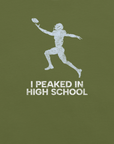 Close-up of olive Milk Sandwich T-shirt with distressed white football player graphic and text I Peaked in High School, ronic athletic nostalgia tee.