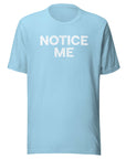 Front view of a ocean blue Milk Sandwich t-shirt with bold distressed white text that says NOTICE ME in uppercase letters.
