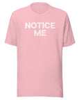 Front view of a pink Milk Sandwich t-shirt with bold distressed white text that says NOTICE ME in uppercase letters.