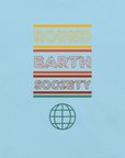 Close-up of a Milk Sandwich ocean blue t-shirt featuring a colorful retro-style graphic with the words ROUND EARTH SOCIETY in yellow, orange, and red stripes above a teal globe icon.
