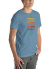Man wearing a steel blue Milk Sandwich t-shirt with a colorful "Round Earth Society" graphic printed vertically on the front.