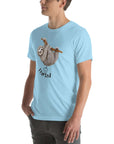 Man in a light blue Milk Sandwich t-shirt with a humorous sloth illustration and the text I farted underneath, standing with one hand in his pocket.