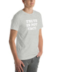 Unisex light gray Milk Sandwich T-shirt featuring the bold phrase "TRUTH IS NOT FACT" for stylish everyday wear.