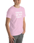 Unisex pink Milk Sandwich T-shirt with "TRUTH IS NOT FACT" slogan, showcasing soft, stretchy fabric and a flattering fit.