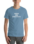 Man wearing a steel blue t-shirt with the text ‘HIGH ON CREATIVITY’ in bold white capital letters, centered on the chest