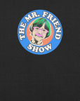 The Mr. Friend Show logo featuring a colorful illustrated portrait of an elderly person with green hair, pink glasses, and a pink mustache, on a black t-shirt background.