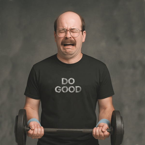 Crying man lifting weights in black Milk Sandwich T-shirt with distressed white DO GOOD text, humorous motivational gym tee with vintage vibes.