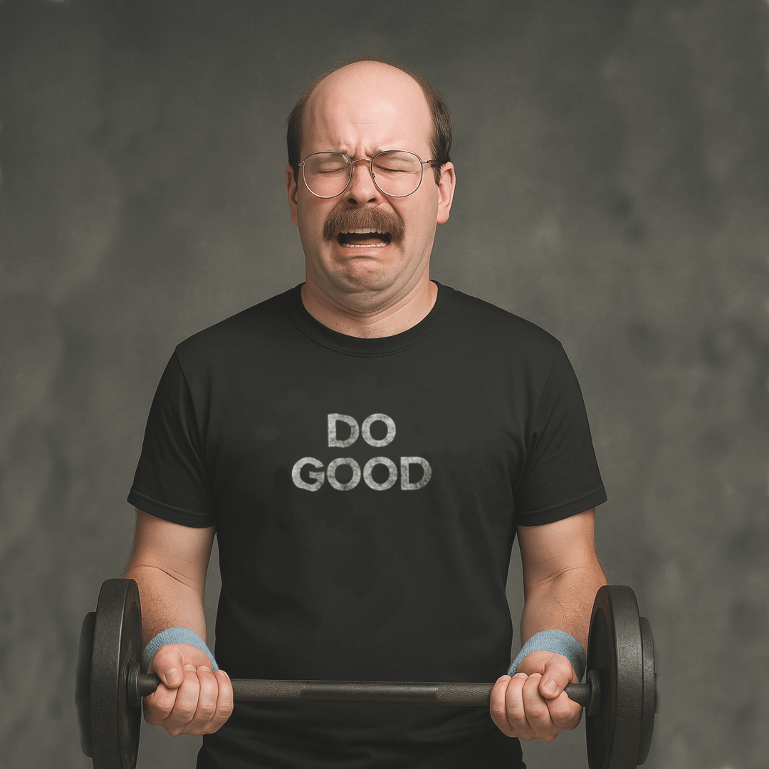 Crying man lifting weights in black Milk Sandwich T-shirt with distressed white DO GOOD text, humorous motivational gym tee with vintage vibes.