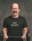 Crying man lifting weights in black Milk Sandwich T-shirt with distressed white DO GOOD text, humorous motivational gym tee with vintage vibes.