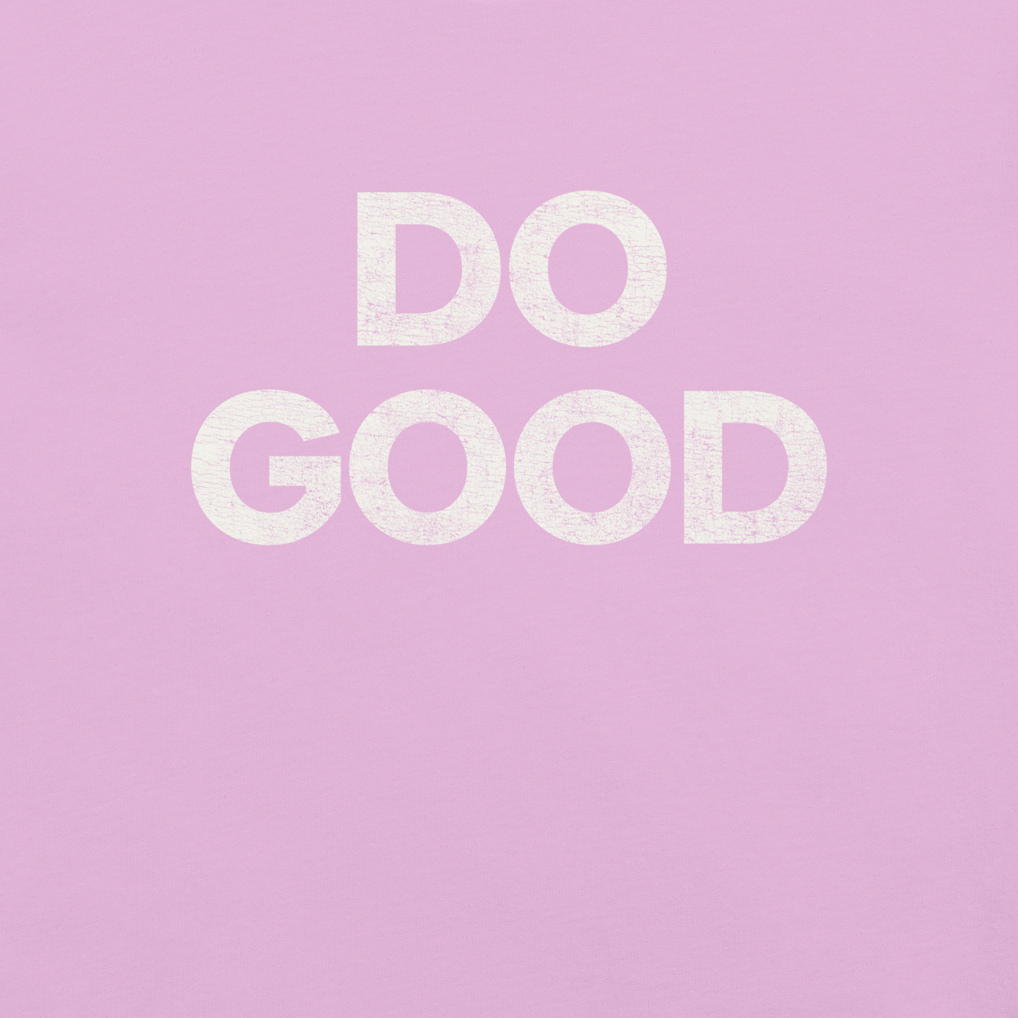 Close-up of pink Milk Sandwich T-shirt with bold distressed white text that reads DO GOOD minimalist motivational graphic tee.