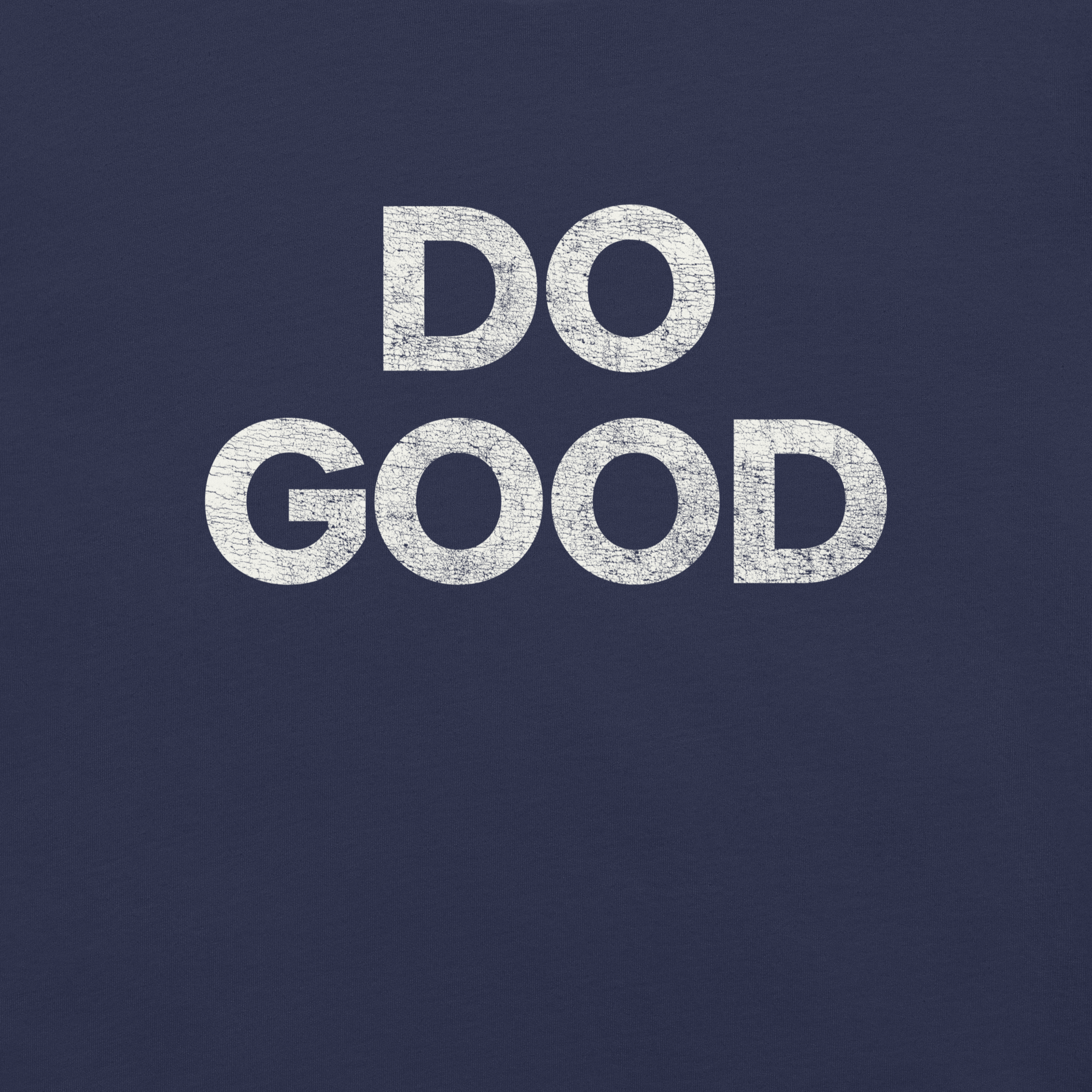 Close-up of navy Milk Sandwich T-shirt with bold distressed white text that reads DO GOOD, minimalist motivational graphic tee.