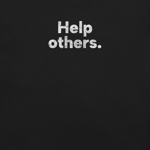 Close-up of black Milk Sandwich T-shirt with distressed white text that reads Help others. simple and bold minimalist message tee.