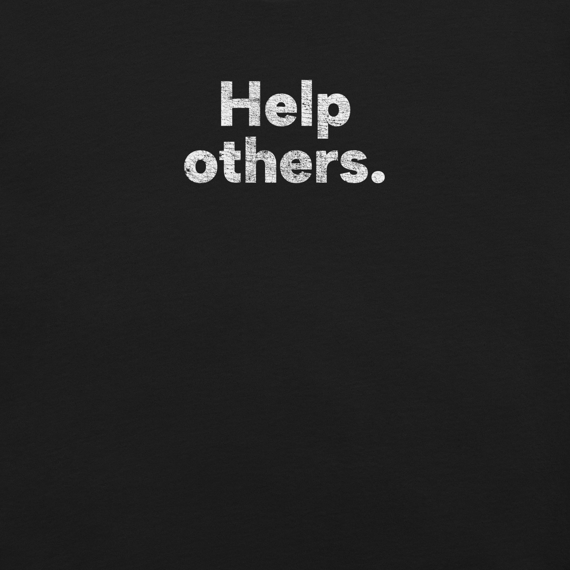 Close-up of black Milk Sandwich T-shirt with distressed white text that reads Help others. simple and bold minimalist message tee.
