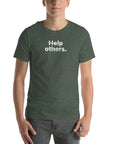 Front view of man wearing heather forest Milk Sandwich T-shirt with faded white text that reads Help others clean, minimalist message tee for everyday wear.