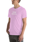 Side view of man wearing a lilac Milk Sandwich T-shirt with distressed white Help others text, casual unisex message tee with minimalist design.