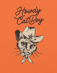 Close-up of orange Milk Sandwich T-shirt with Howdy CatBoy text and detailed illustration of a cowboy cat wearing a hat and bandana.