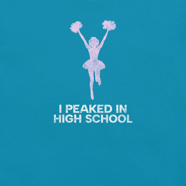 Close-up of aqua Milk Sandwich T-shirt with distressed pink cheerleader graphic and white text that reads I Peaked in High School, sarcastic retro tee.