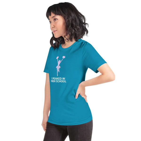 Unisex aqua Milk Sandwich T-shirt  in teal with "I Peaked in High School" design, showcasing a stylish fit and comfortable fabric.