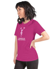 Model wearing a vibrant berry unisex Milk Sandwich T-shirt  that says "I Peaked in High School" with a cheerful cheerleader graphic.