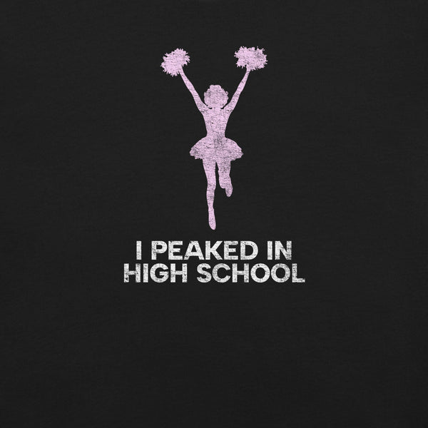 Close-up of black Milk Sandwich T-shirt with distressed pink cheerleader graphic and white text that reads I Peaked in High School, sarcastic retro tee.