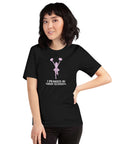 Cheerful person wearing a Milk Sandwich T-shirt  "I Peaked in High School" unisex t-shirt, showing off fun cheerleading graphic on a black background.