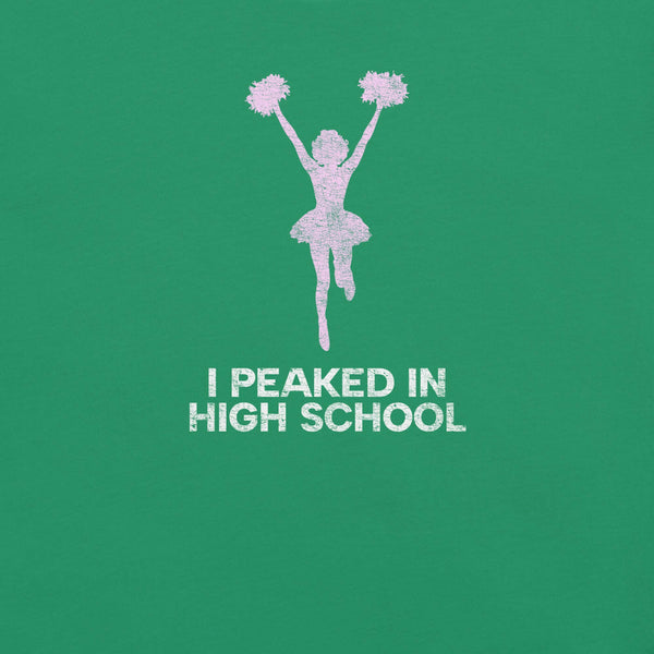 Close-up of green Milk Sandwich T-shirt with distressed pink cheerleader graphic and white text that reads I Peaked in High School, sarcastic retro tee.