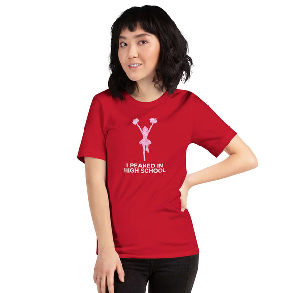 Unisex red Milk Sandwich T-shirt featuring "I Peaked in High School" slogan, perfect for cheerleading fans and nostalgic vibes.