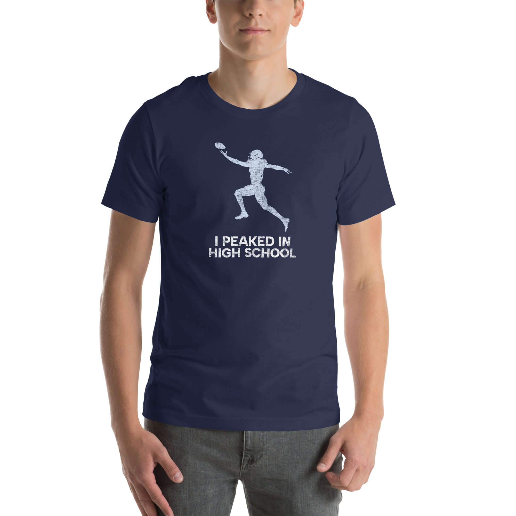 Unisex navy Milk Sandwich T-shirt featuring humorous "I Peaked In High School" design with a football player graphic. Perfect for sports fans.