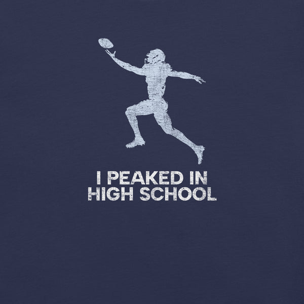 Close-up of navy Milk Sandwich T-shirt with distressed white football player graphic and text I Peaked in High School, ironic athletic nostalgia tee.