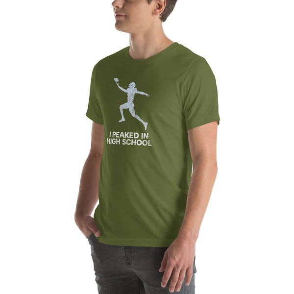 Olive green unisex Milk Sandwich T-shirt featuring 'I Peaked In High School' graphic, perfect for sports fans and nostalgia lovers.