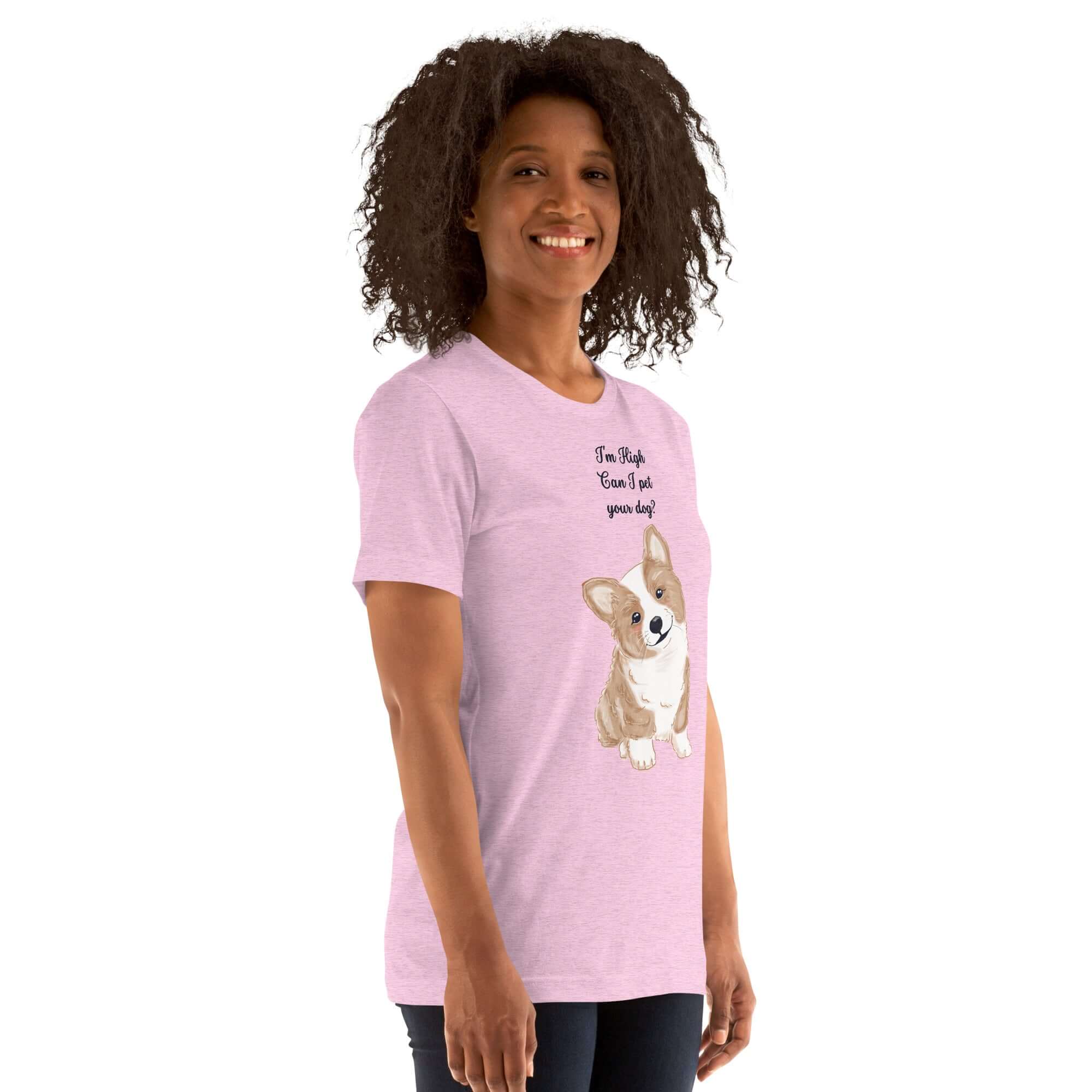 Woman wearing a soft pink Milk Sandwich T-shirt with a cute corgi graphic and the text, "I'm High, Can I Pet Your Dog."