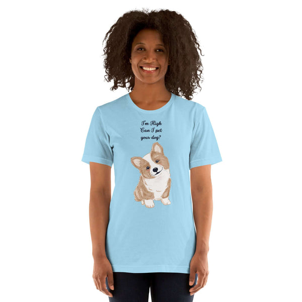 Unisex light blue Milk Sandwich T-shirt with "I'm High, Can I Pet Your Dog?" and cute corgi design, worn by a smiling person.