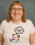 Smiling woman with glasses wearing a white t-shirt that says “TOLD YOU THE DARK WEB IS FUN” with cartoon kids on laptops.