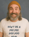 Smiling man with beanie and beard wearing a white “DON’T BE A PEE PEE POO POO HEAD” t-shirt.          Preguntar a ChatGPT