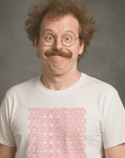 Man with glasses and mustache wearing a white “TRIGGERED” t-shirt, looking surprised and goofy in a vintage studio photo.