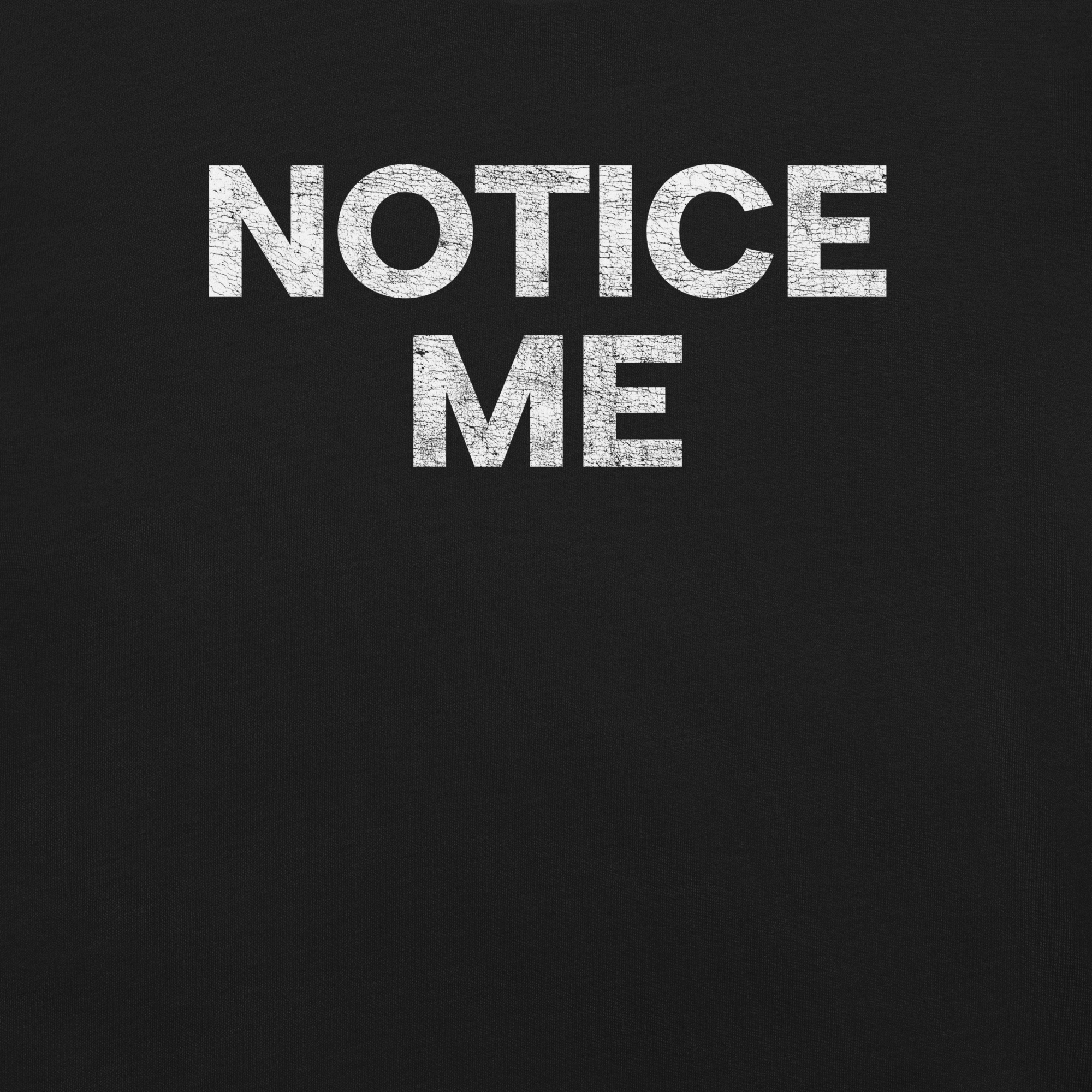 Close-up of a black Milk Sandwich t-shirt featuring bold white distressed text that reads NOTICE ME in all caps.