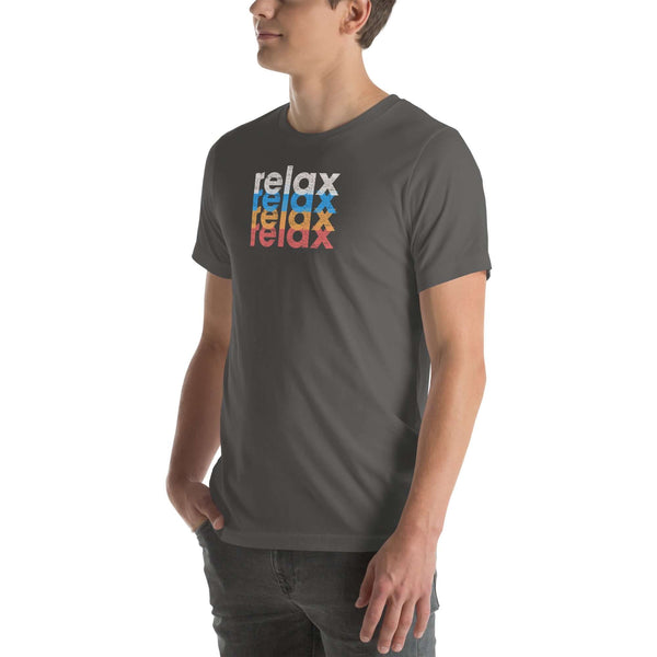 Side view of a man wearing a Milk Sandwich asphalt t-shirt featuring a stacked relax text design in distressed white, blue, orange, and pink colors.