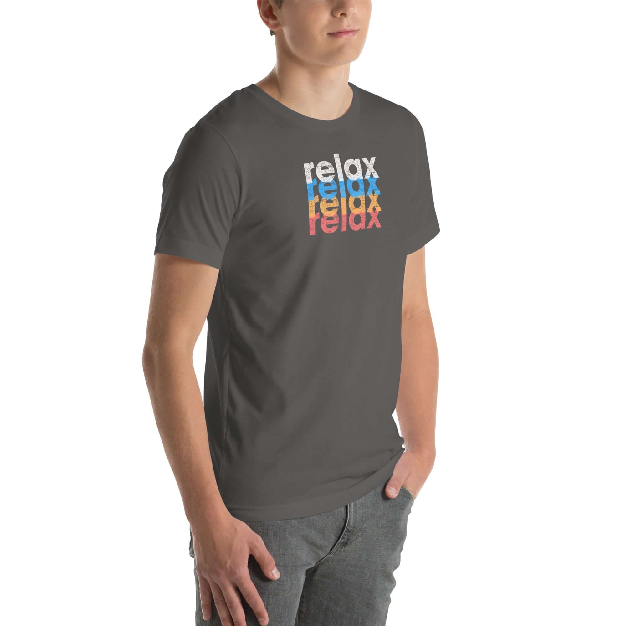 Angled front view of a man wearing a Milk Sandwich asphalt t-shirt with a colorful distressed relax text design repeated vertically in white, blue, orange, and pink.