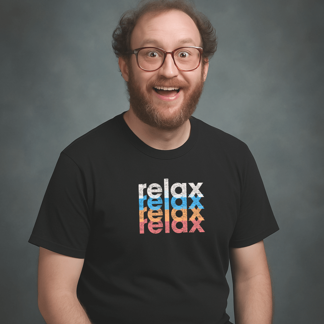 Smiling man with glasses and beard wearing a black Milk Sandwich t-shirt featuring a colorful stacked relax design in white, blue, orange, and pink text.
