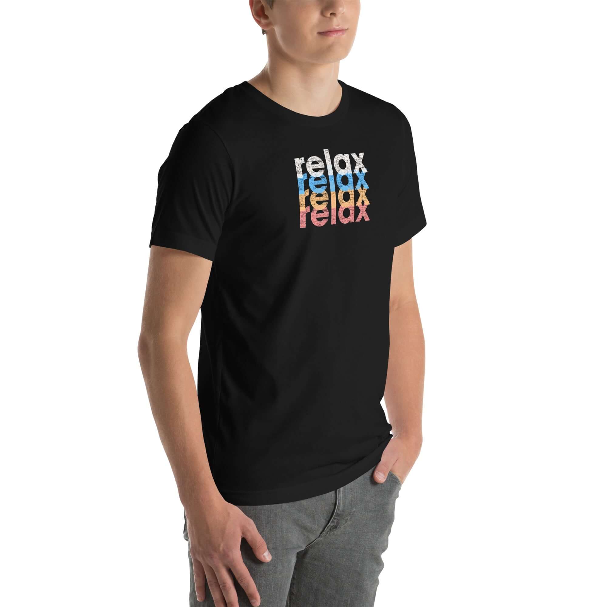 Angled front view of a man wearing a Milk Sandwich black t-shirt with a colorful distressed relax text design repeated vertically in white, blue, orange, and pink.