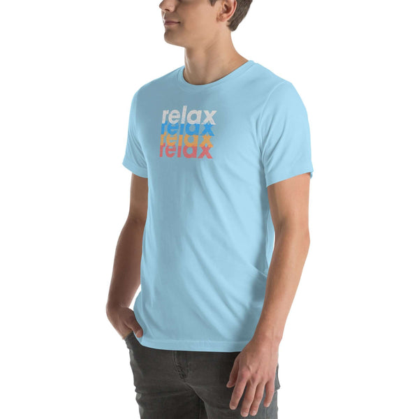 Side view of a man wearing a Milk Sandwich ocean blue t-shirt featuring a stacked relax text design in distressed white, blue, orange, and pink colors.