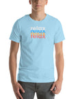 Man wearing a Milk Sandwich ocean blue t-shirt with a colorful stacked relax text design in white, blue, orange, and pink distressed print.