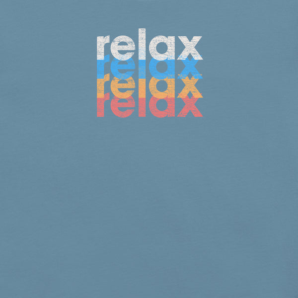 Close-up of a Milk Sandwich t-shirt featuring a stacked and mirrored relax text design in distressed white, blue, orange, and pink colors on steel blue fabric.