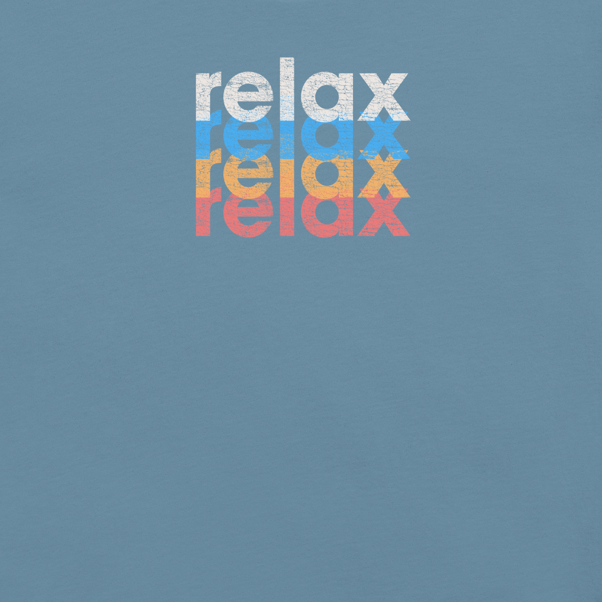 Close-up of a Milk Sandwich t-shirt featuring a stacked and mirrored relax text design in distressed white, blue, orange, and pink colors on steel blue fabric.
