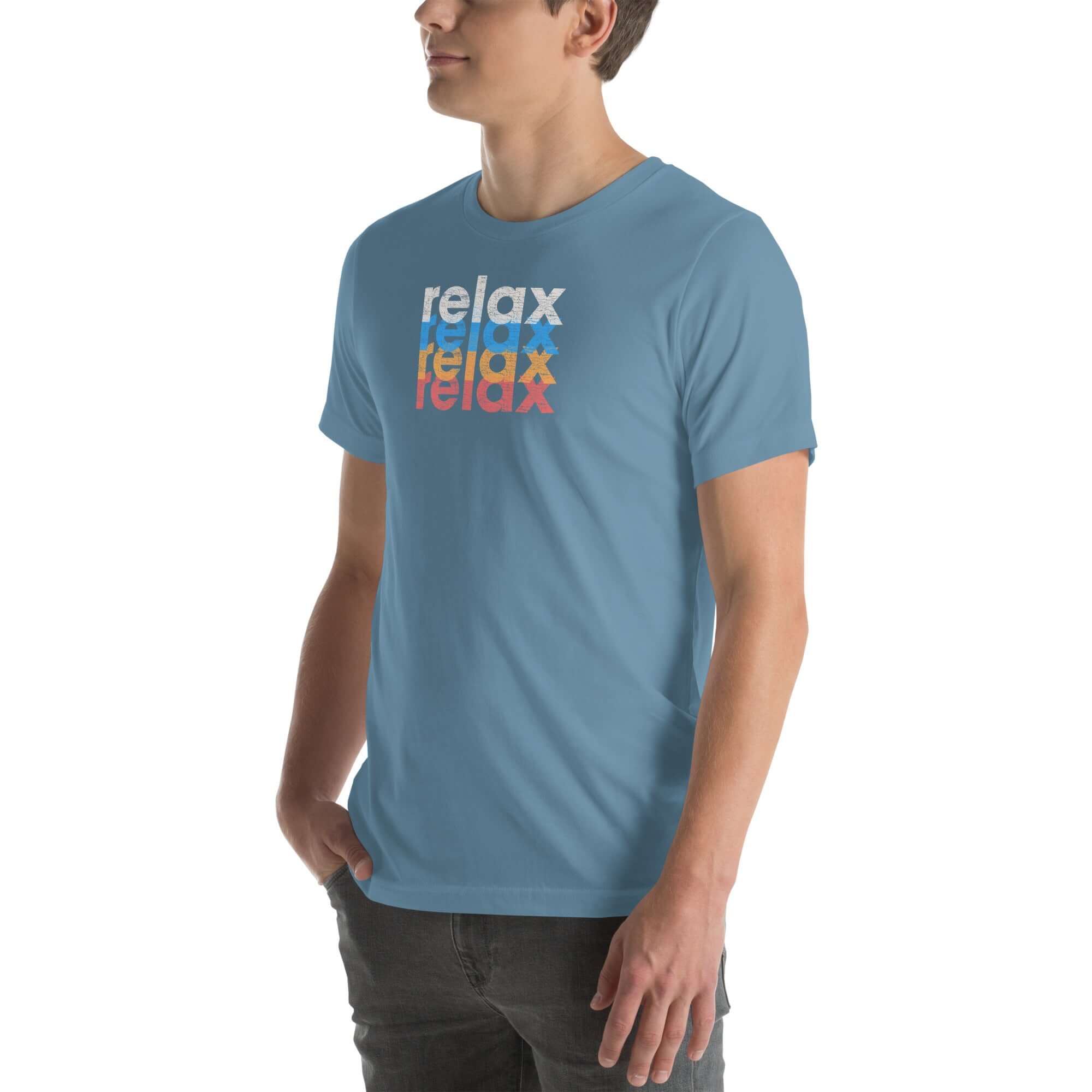 Side view of a man wearing a Milk Sandwich steel blue t-shirt featuring a stacked relax text design in distressed white, blue, orange, and pink colors.