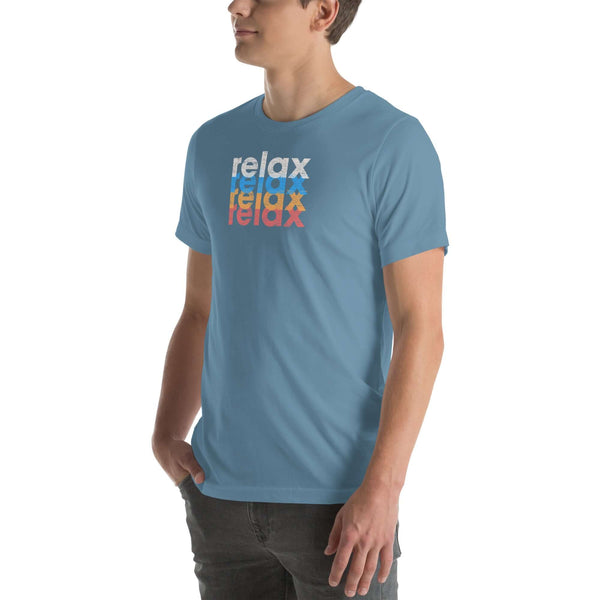 Side view of a man wearing a Milk Sandwich steel blue t-shirt featuring a stacked relax text design in distressed white, blue, orange, and pink colors.